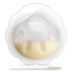 haakaa Petal Soft Milk Collector inside bra captures letdown discreetly for hands-free daily use.