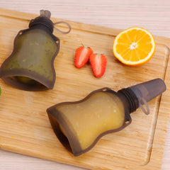 Haakaa portable food dispensing spoon ideal for outdoors and travel.