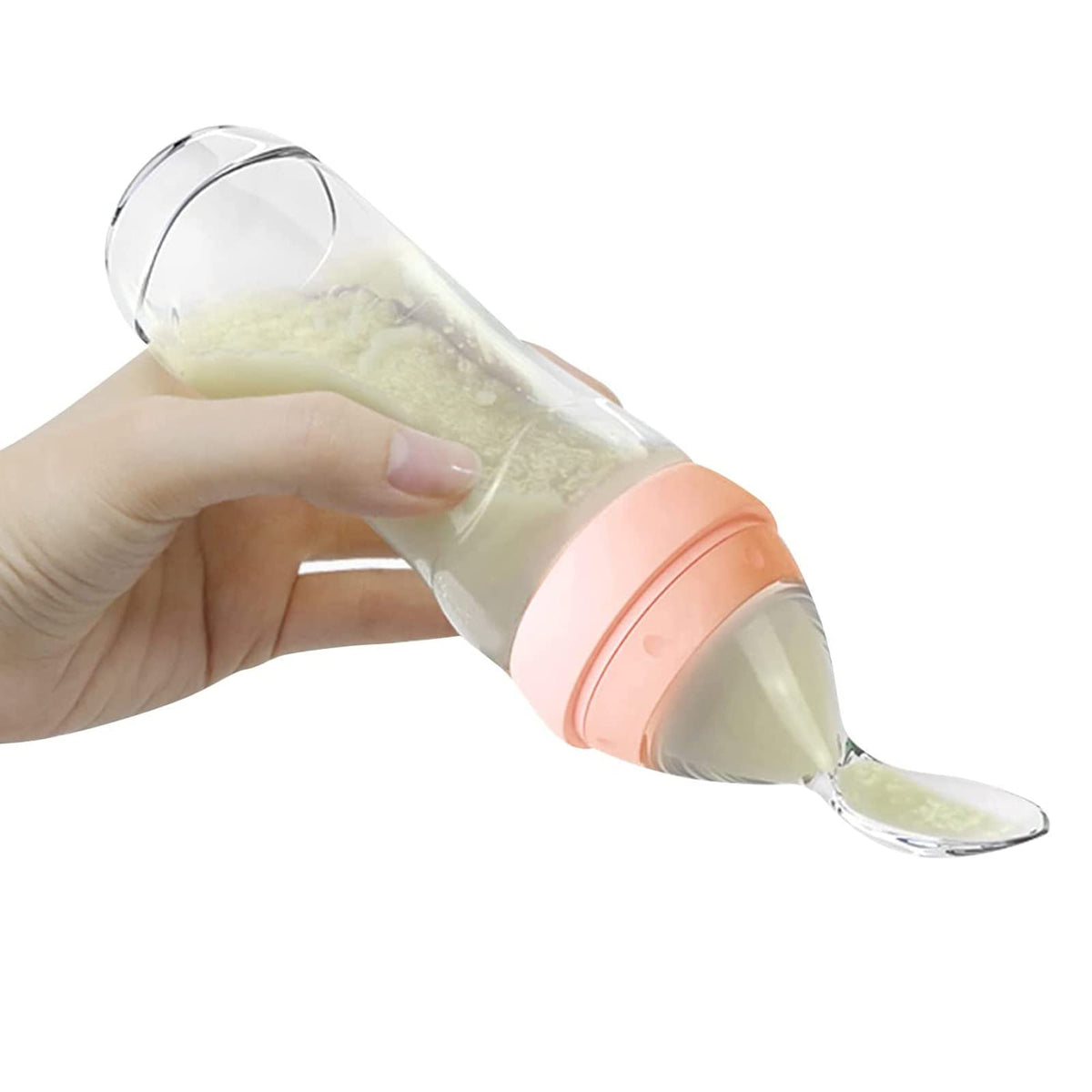 Haakaa silicone baby food dispensing spoon in peach for mess-free feeding on the go.