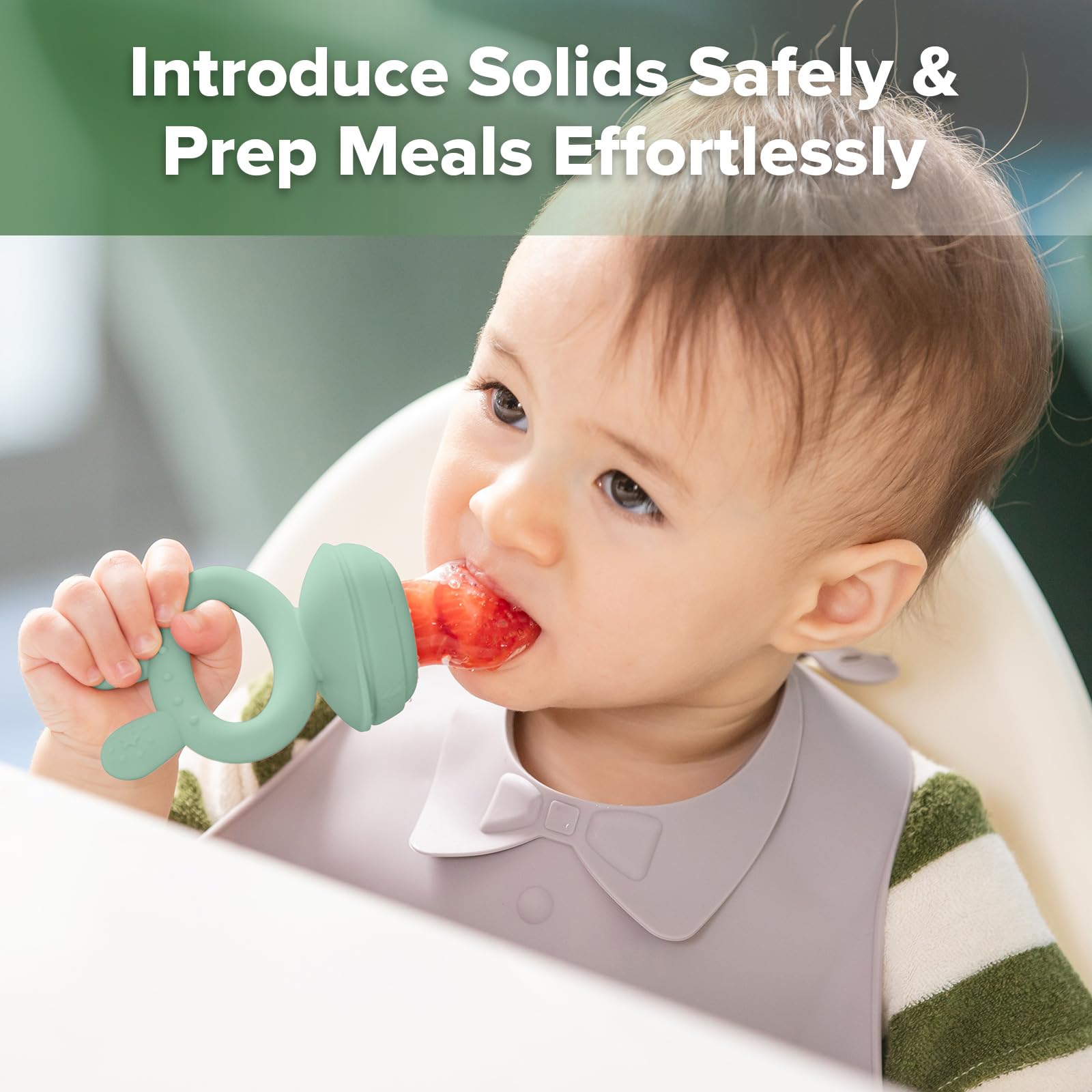Haakaa silicone feeder in hands demonstrates easy-to-hold design for little hands.
