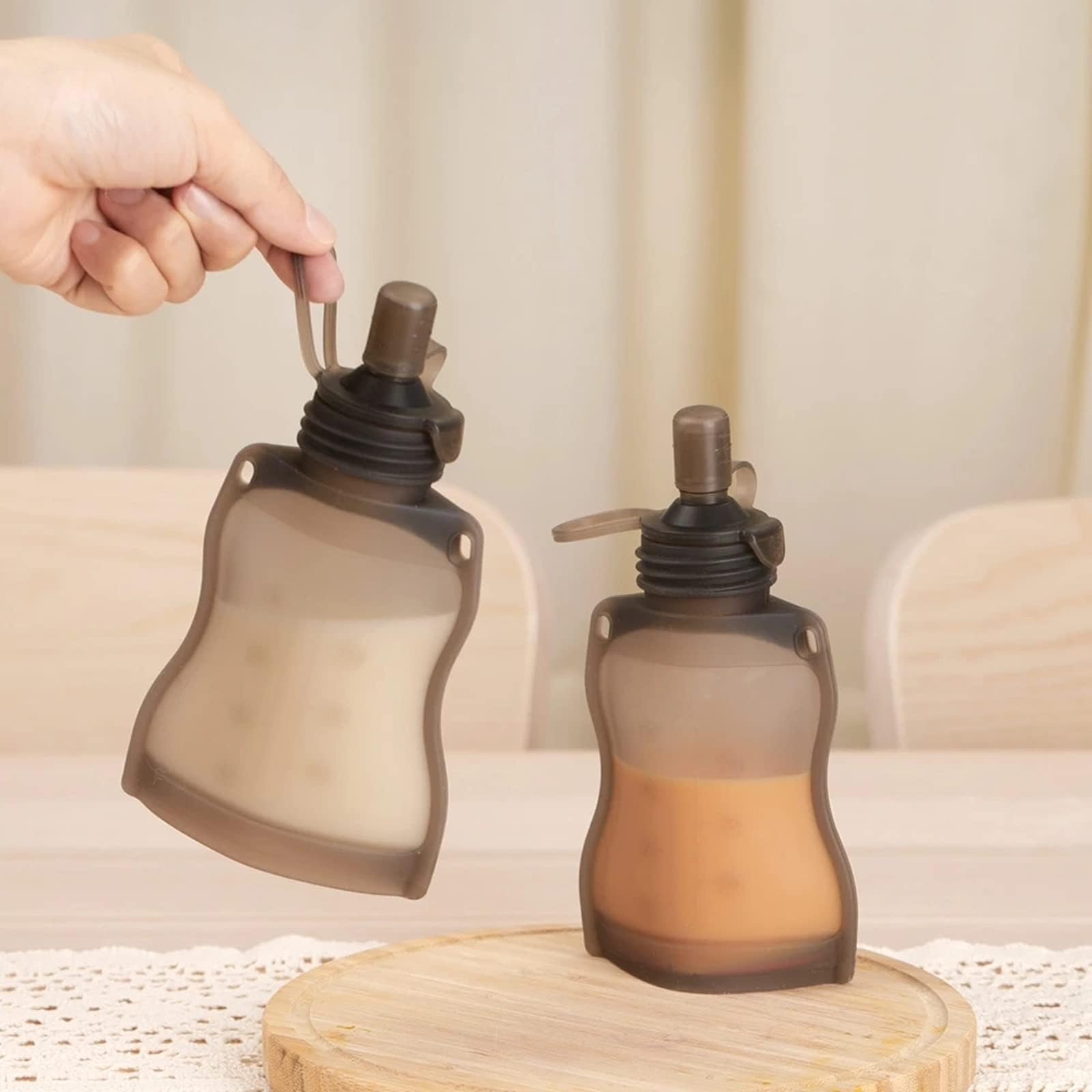 haakaa Yummy Pouch Sippy Spout grey demonstrates compatibility with Yummy Pouches for quick meals.