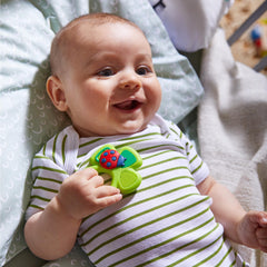 HABA Lucky Shamrock teether held by toddler promoting tactile exploration
