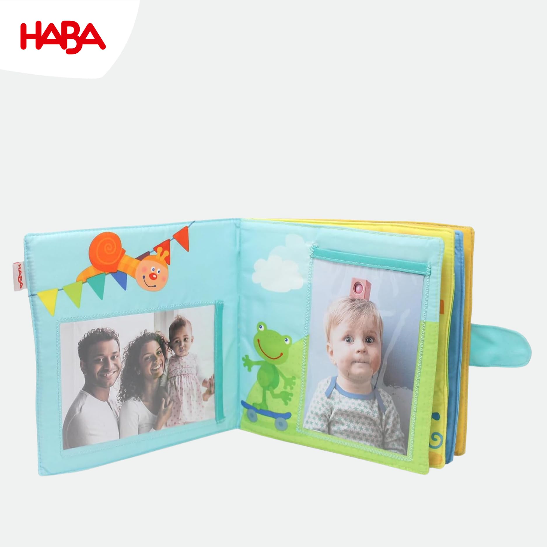 HABA My First Photo Album holds eight 4x6 photos for cherished moments.
