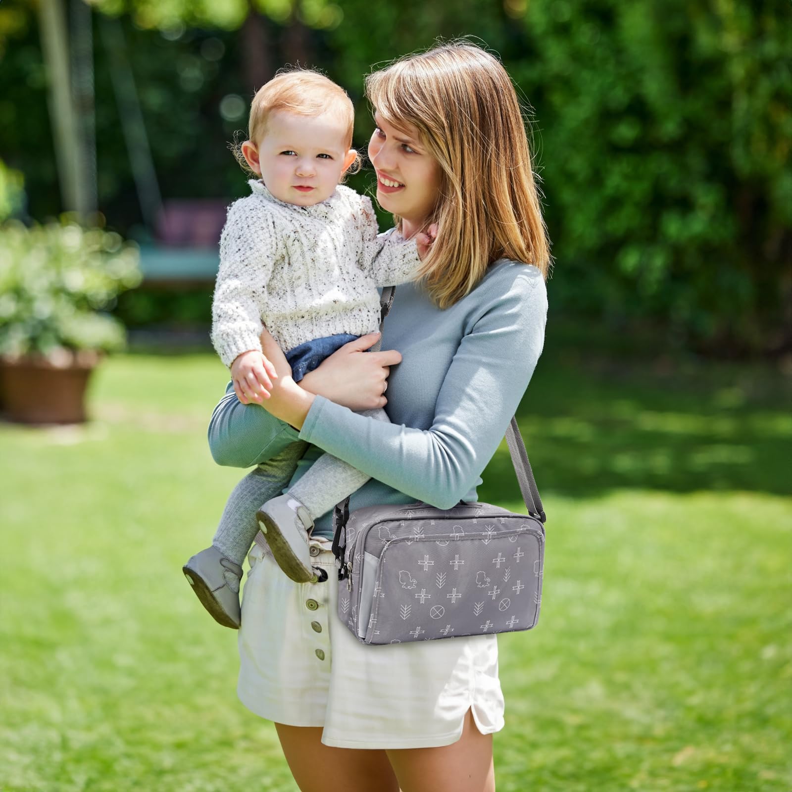 Hacaroa small diaper bag with water-resistant oxford exterior for outdoor use.