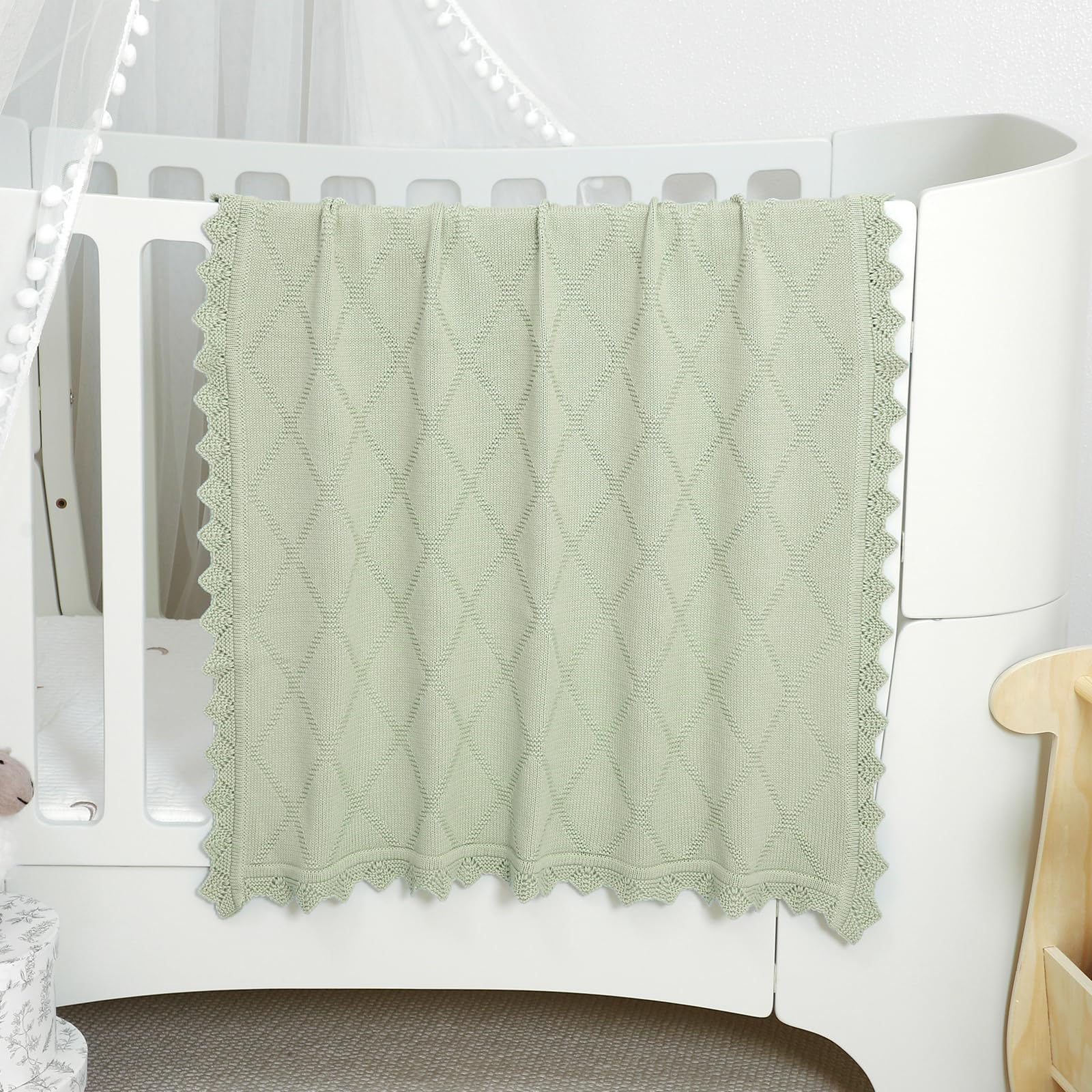 Hadetoto knit baby blanket used as a stroller cover for on the go protection