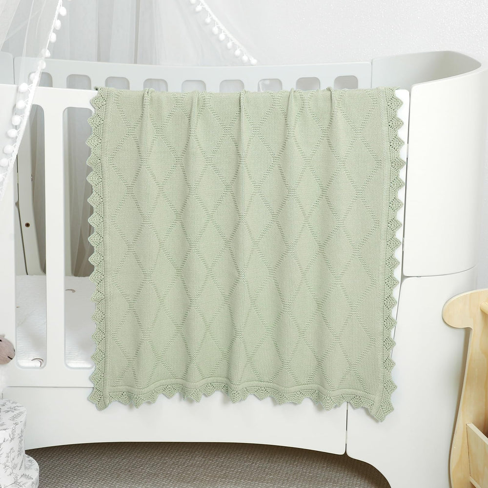 Hadetoto knit baby blanket used as a stroller cover for on the go protection