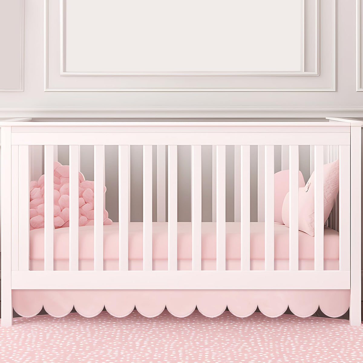 Hahafelt pink scalloped crib skirt front view adds timeless nursery charm and easy coordinating decor.