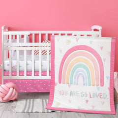 Hahafelt rainbow boho crib quilt showcases pastel rainbow print for a cozy nursery ambience.