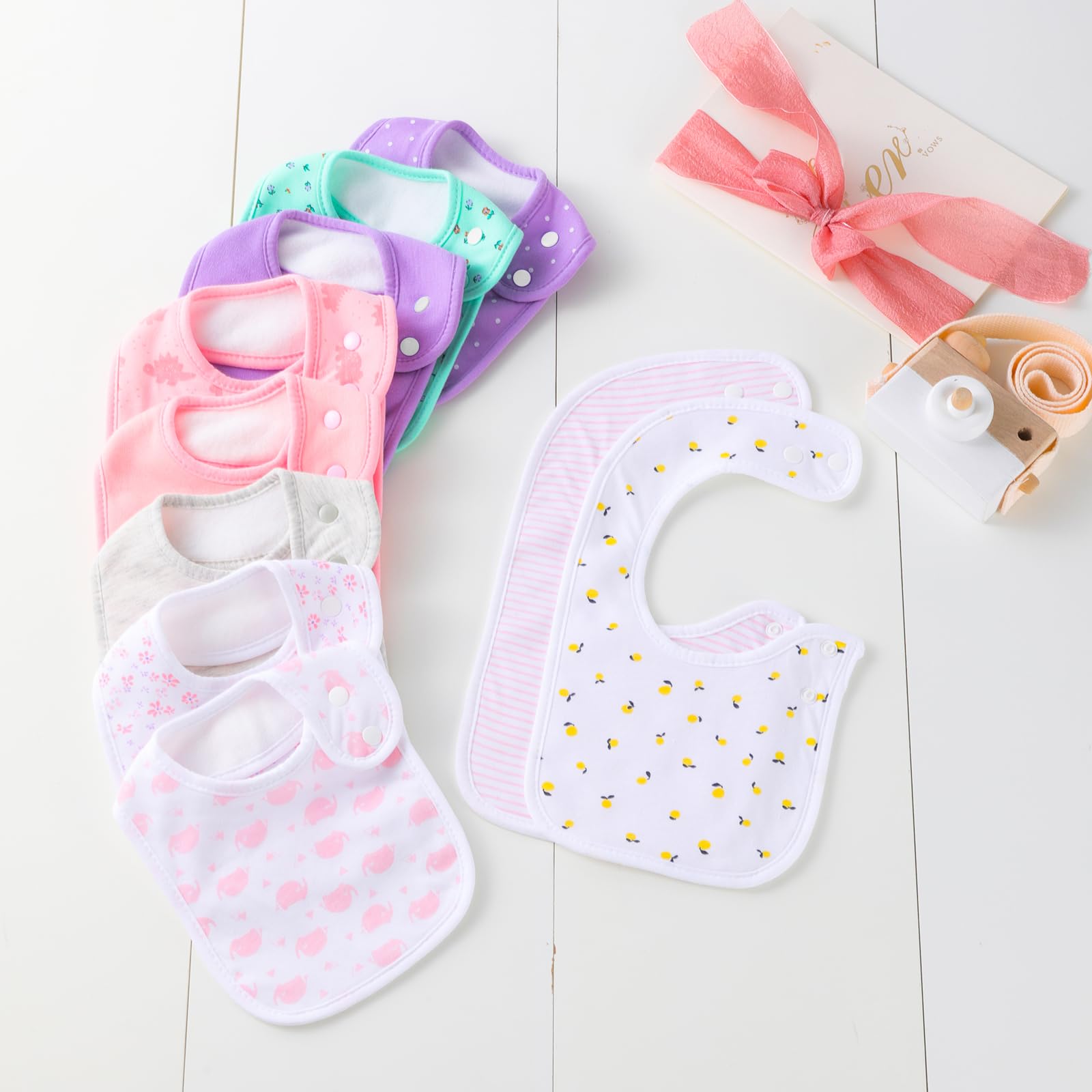 Hakochia ten-pack bandana bibs spread out for outfit coordination
