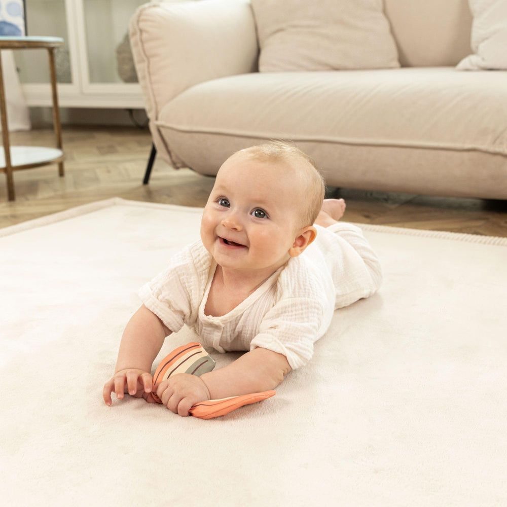 Hakuna Matte 80x110 beige mat enhances nursery while supporting active play