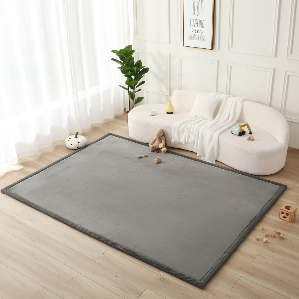 Hakuna Matte Premium Baby Playmat top view in dark gray supports tummy time and comfort.