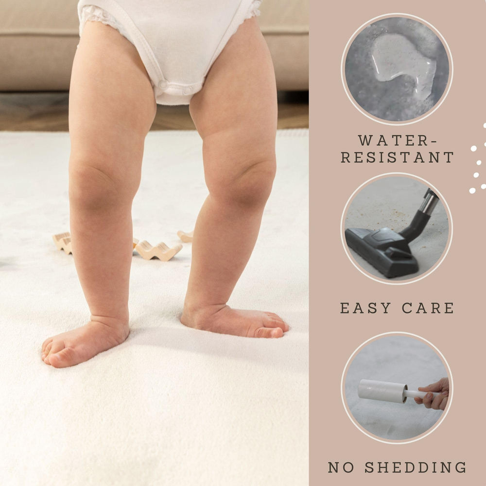 Hakuna Matte Premium Baby Playmat water-resistant cleaning demonstrates quick wipe-downs after spills.
