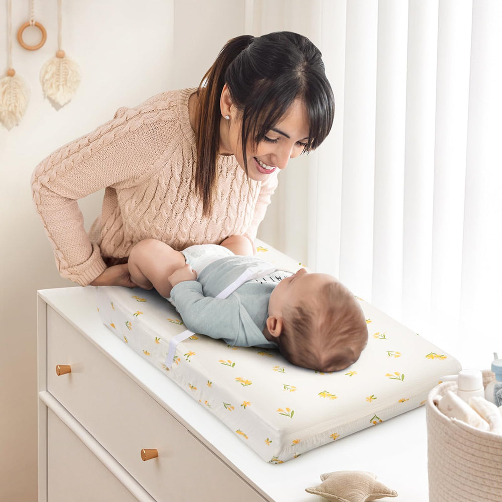 Haleeone floral green cover displayed on changing pad with breathable, lightweight material.