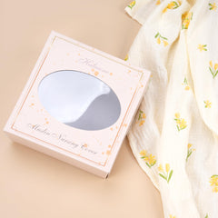 Haleeone nursing cover with arch neckline and adjustable strap enables comfortable eye contact.