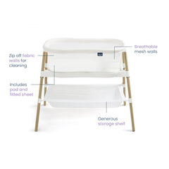 Halo BassiNest Essential Sleeper side-view highlighting portable bedside setup.