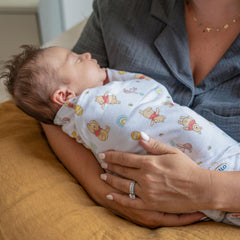 HALO Disney Winnie Rainbows sleepsack inverted zipper enables easy diaper changes.