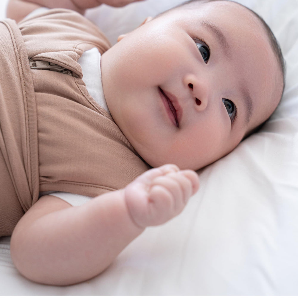 HALO SleepSack 3-way swaddle design demonstrates arms-in/out versatility for baby's preferred sleep position.