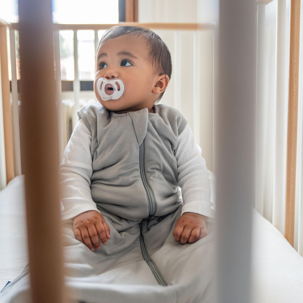 HALO Sleepsack Supersoft infant sleeping bag in bed scene offers cozy sleep setup.