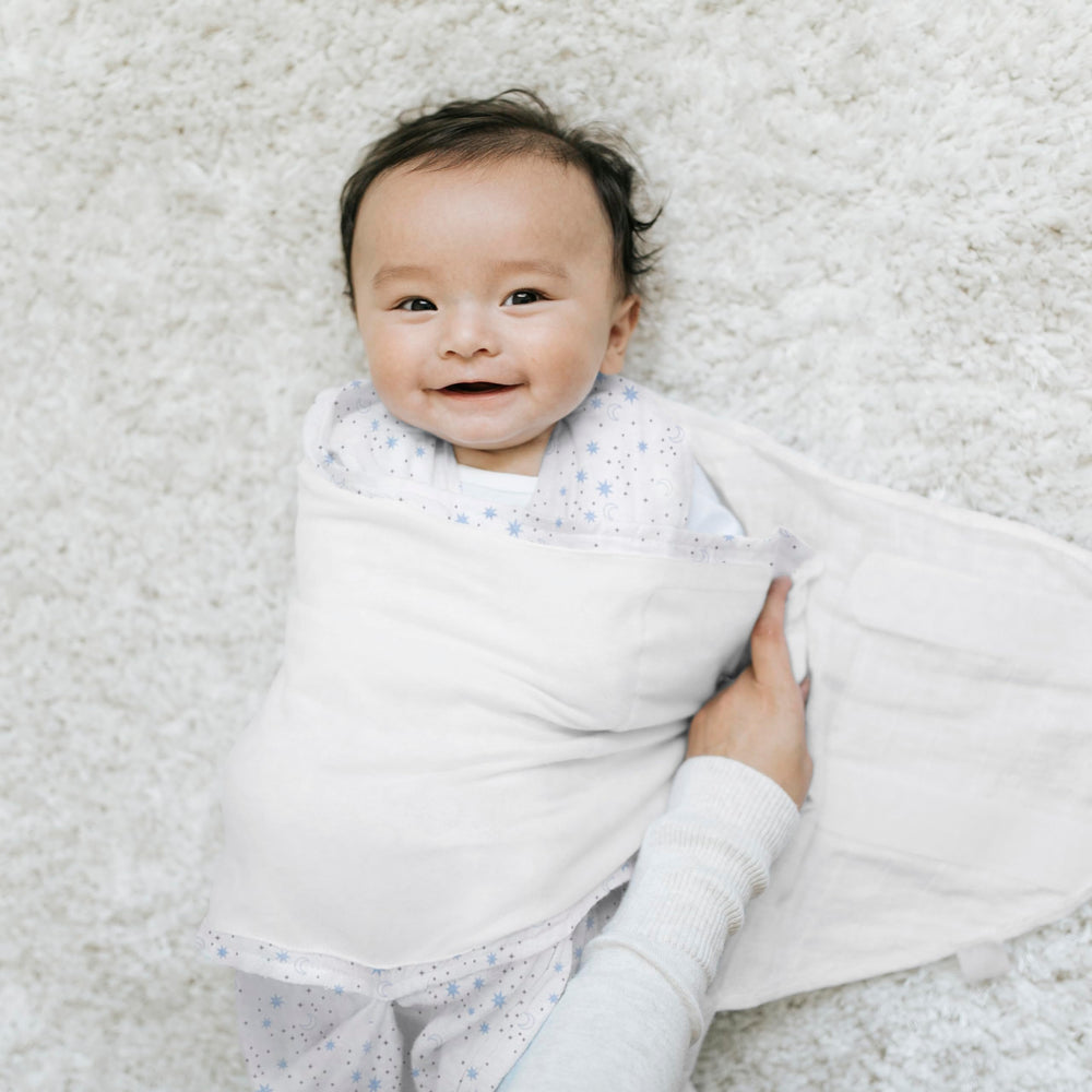 HALO Sleepsack Swaddle Midnight Moons Blue back view highlights snug arms and neck fit