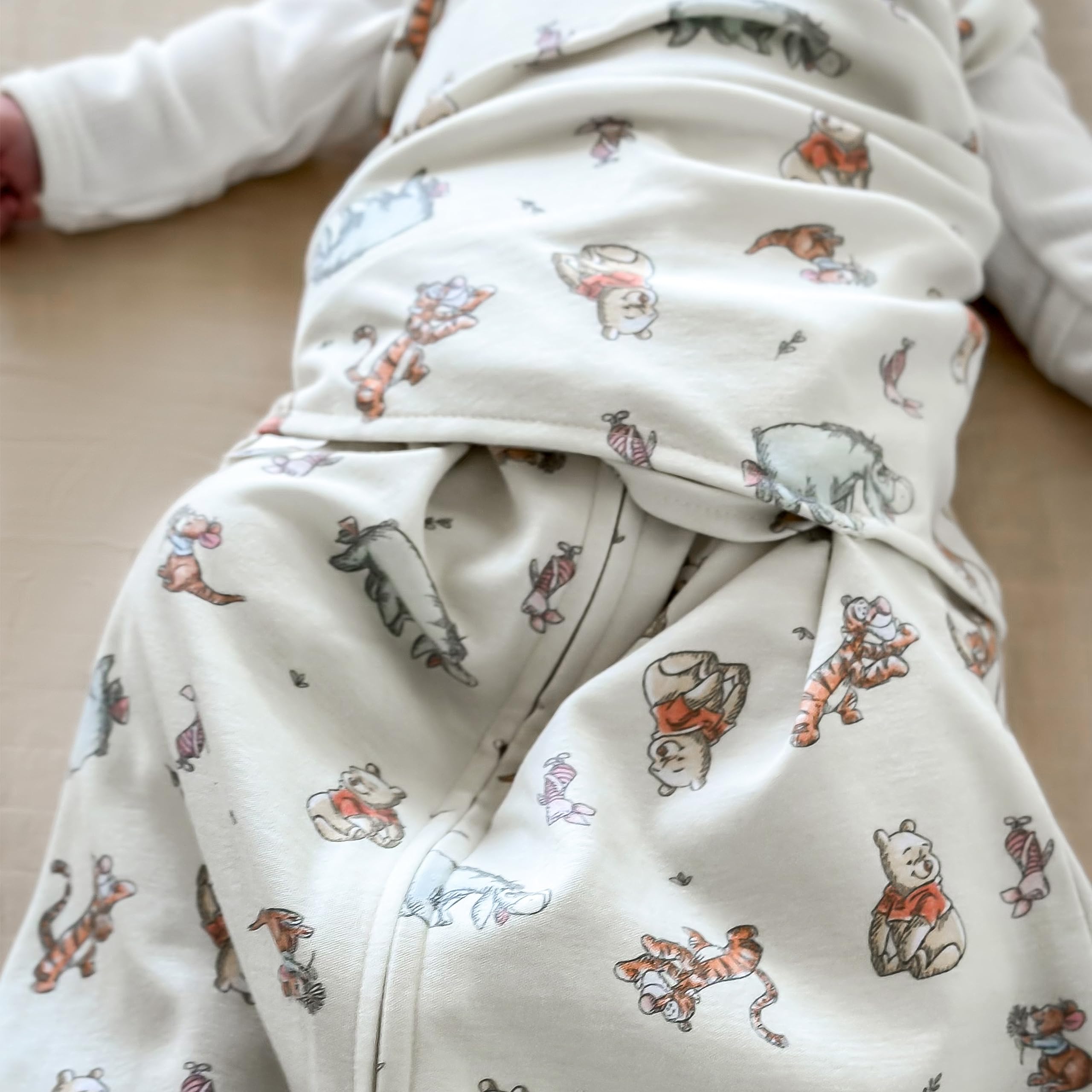 HALO Winnie Frolic hip-healthy label confirms safe sleep design.