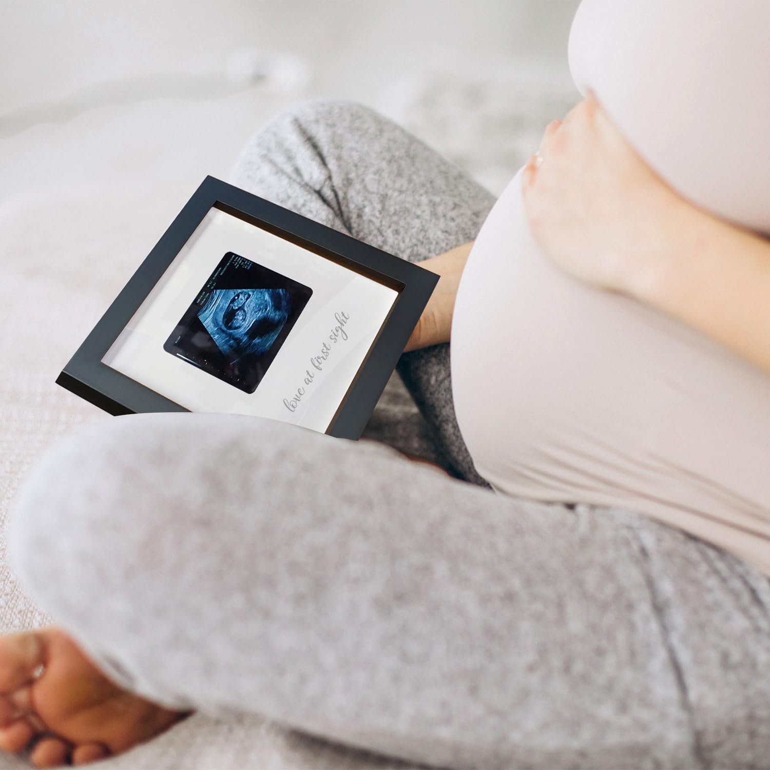 HAMUIERS Love at First Sight frame makes a thoughtful pregnancy announcement gift idea.