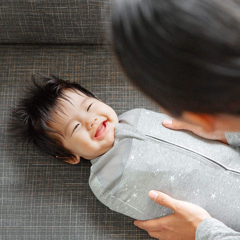 Happiest Baby Sleepea arm-snap design supports flexible arms-out transition