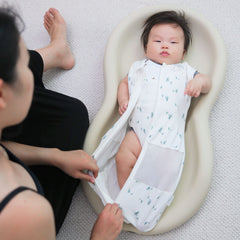 Happiest Baby Sleepea inner flaps demonstrating snug embrace for self-soothing
