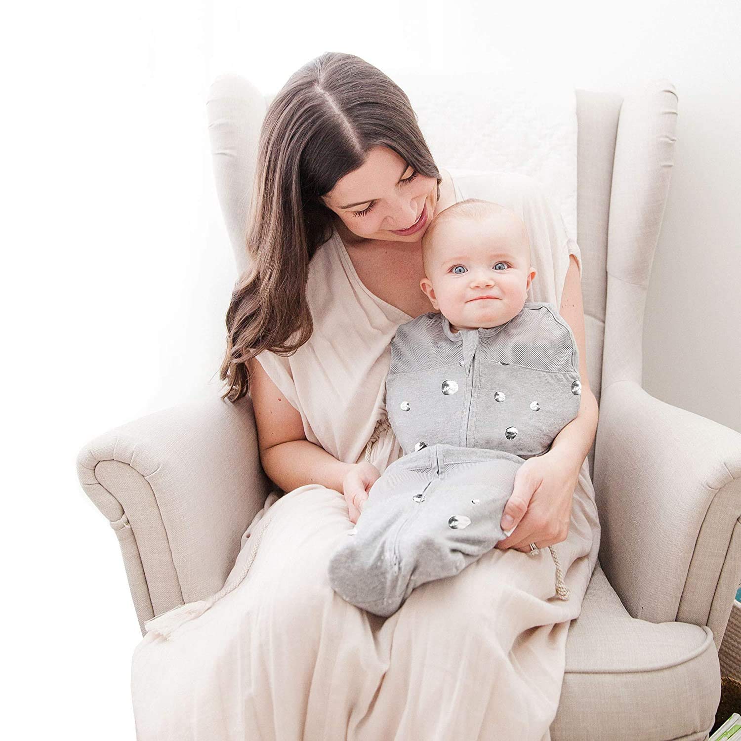 Happiest Baby Sleepea Ivory Planets small breathable mesh reduces overheating on shoulders and legs.