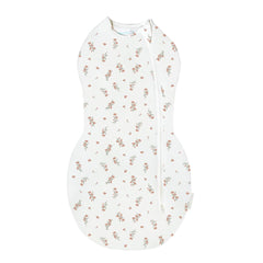 Happiest Baby Sleepea Ivory Wildflowers swaddle showing secure wrap for cozy naps.