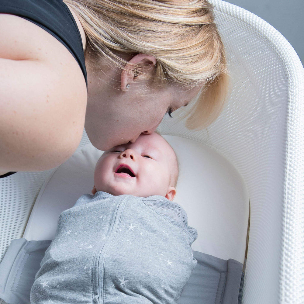 Graphite Planets color of Happiest Baby SNOO Sleep Sack on baby bed