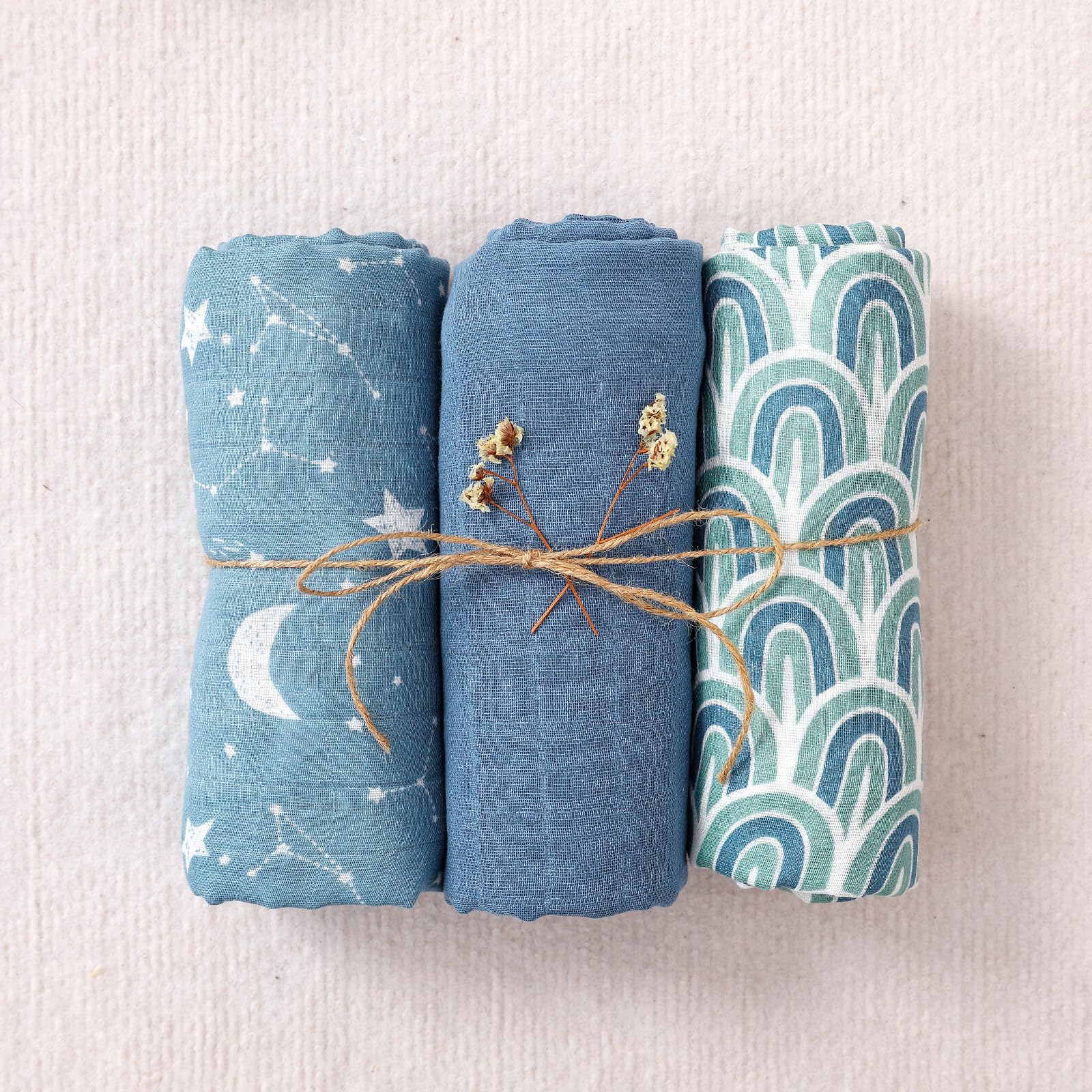 Happy Flute muslin swaddle blankets soft fabric closeup, emphasizing breathable texture ideal for delicate newborn skin.