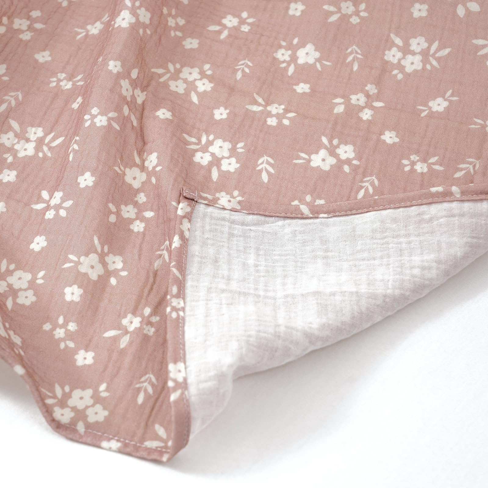 Happy Flute flower-detail swaddle emphasizes soft edges and breathable weave.