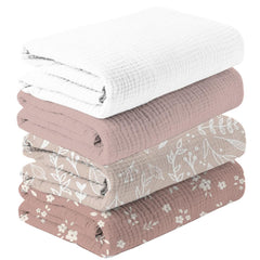 Happy Flute swaddle flower-pattern close-up highlights ultra-soft muslin for newborns.