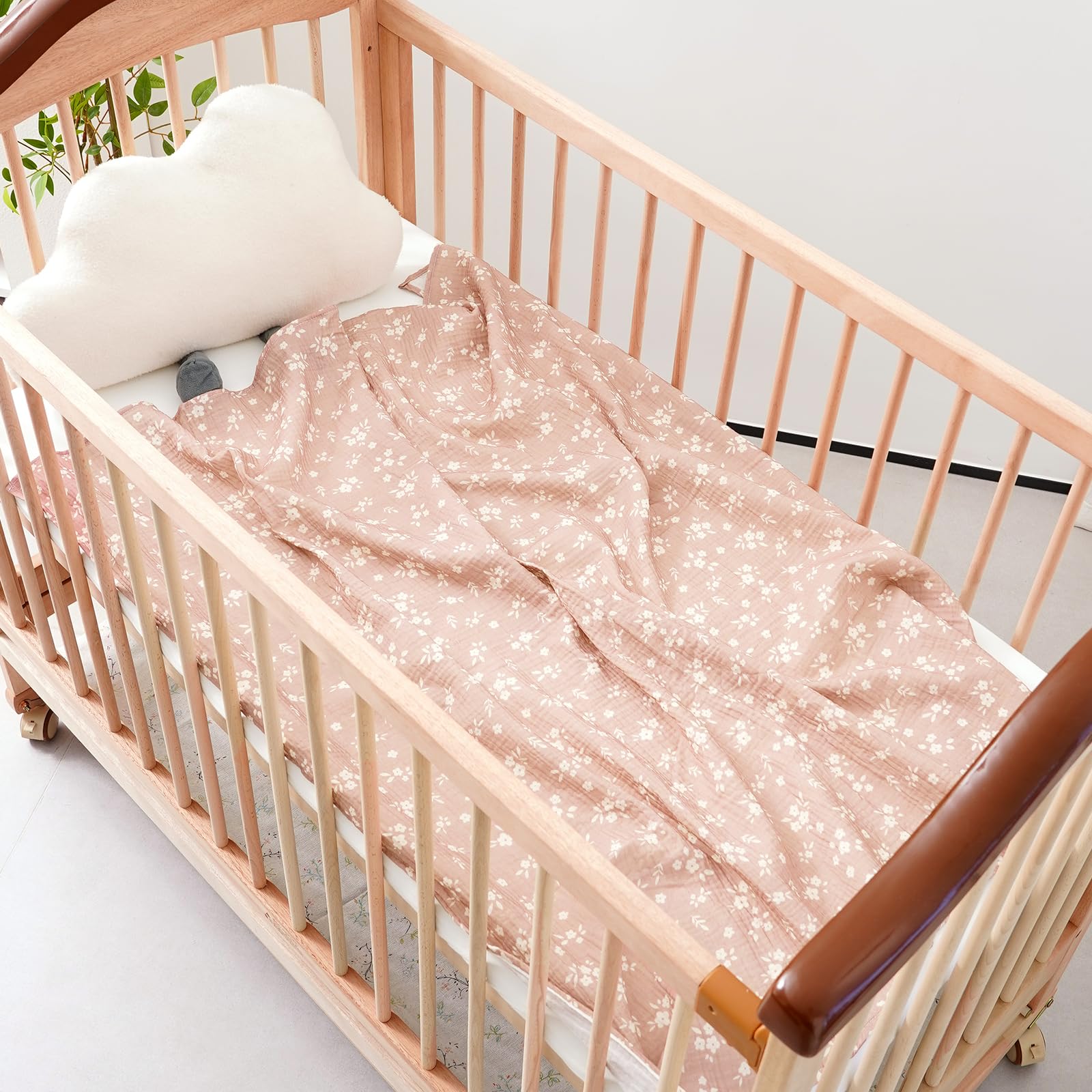 Happy Flute swaddle used as a nursing cover in a relaxed setting.