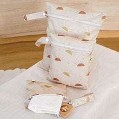 Happy Flute wet bag with three sizes laid out for travel versatility