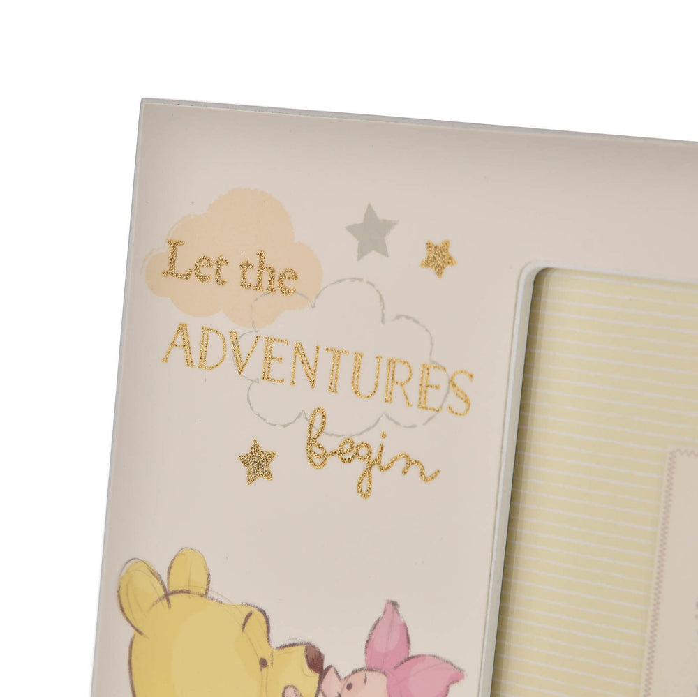 Happy Homewares Winnie Pooh photo frame with gold lettering enhances nursery decor.