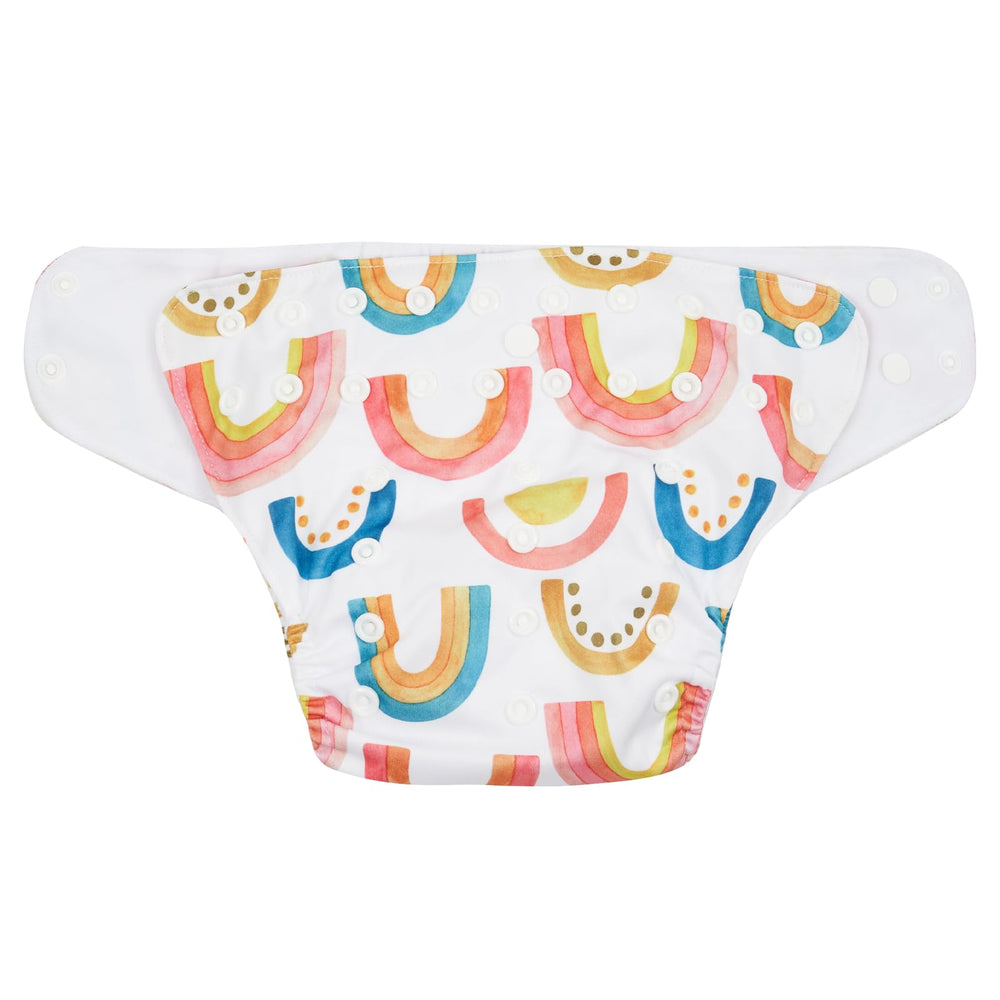 HappyFlute baby wearing diaper set during daily activities in cozy scene.