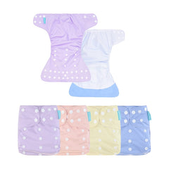 HappyFlute newborn-pocket diapers shown ready for on-the-go reuse.