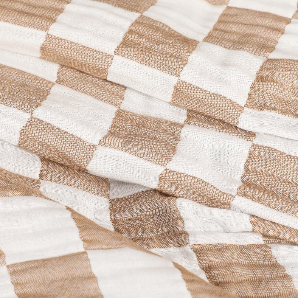HardNok Checkered Muslin Throw is machine washable for easy care and lasting softness.
