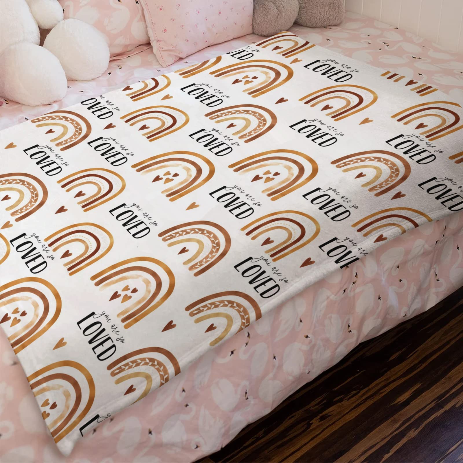 HawSkgFub Boho Rainbow blanket in crib demonstrates lightweight warmth for all seasons.