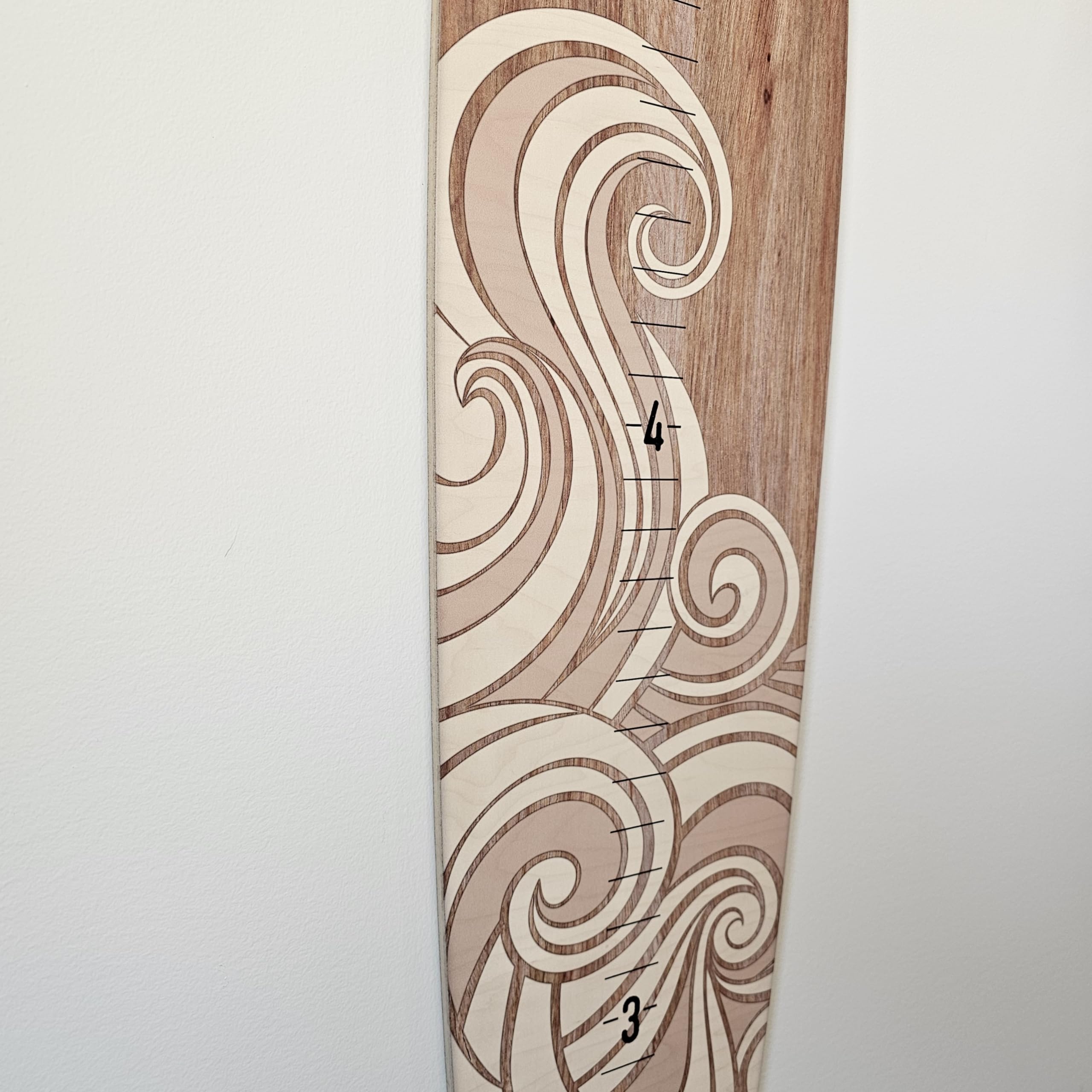 Headwaters Studio wooden surfboard made in USA provides durable wall decor.