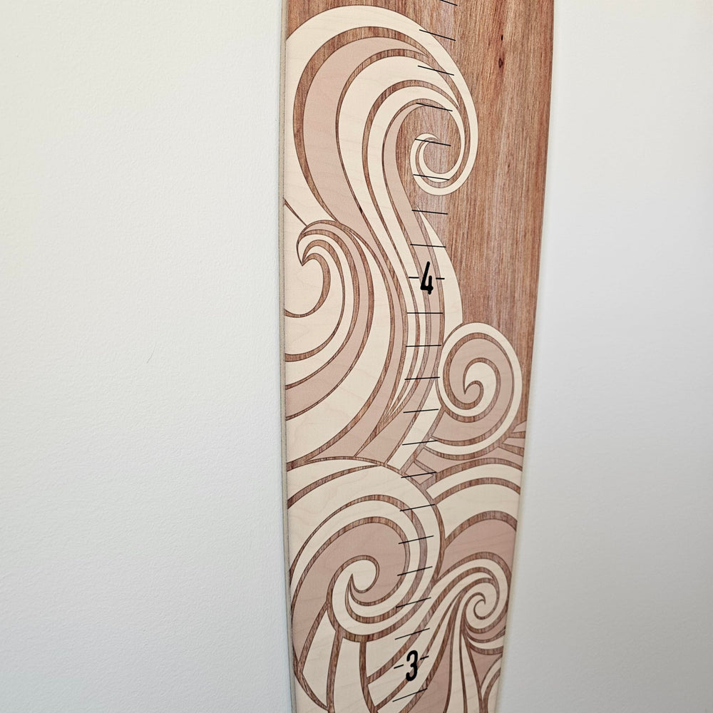 Headwaters Studio wooden surfboard made in USA provides durable wall decor.