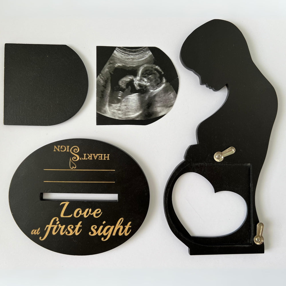 Heart's Sign baby frame complements nursery decor with a personal ultrasound keepsake.