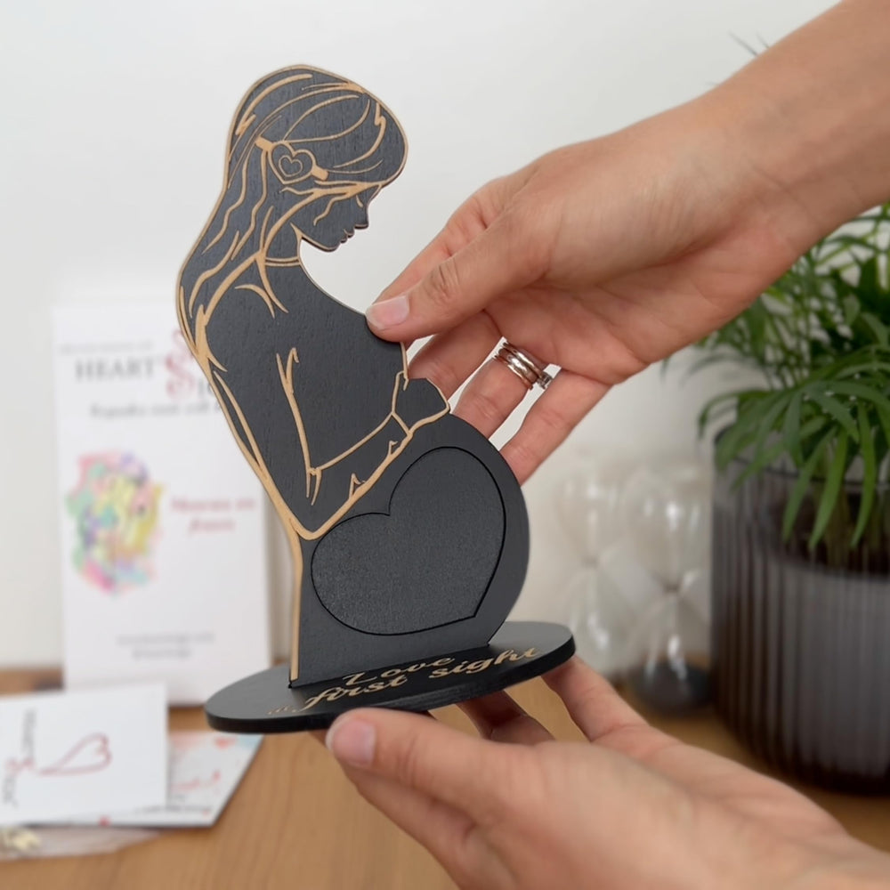 Heart's Sign black ultrasound frame showcases heart-shaped slot for memories.