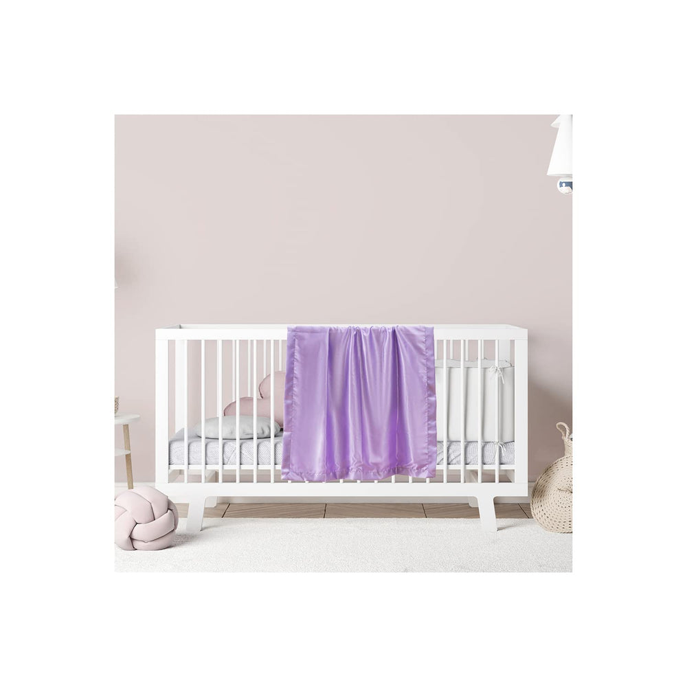 Heavens Cuddles lavender blanket on baby crib demonstrates all-season comfort.