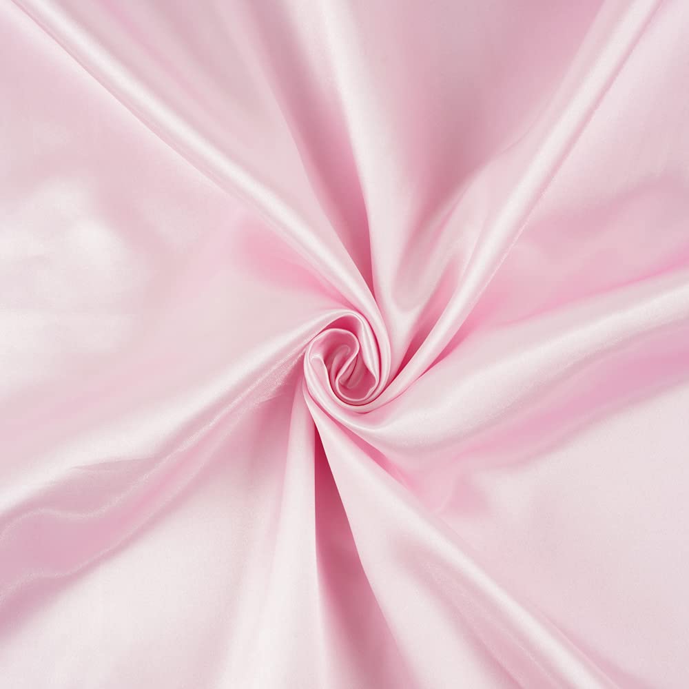 Heavens Cuddles pink satin blanket on a crib for early comfort