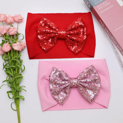 HELYKAKA red bow headband offers lightweight comfort and charm.