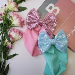 HELYKAKA sequin headbands on baby wearing, versatile one-size-fits-all for newborns to toddlers.