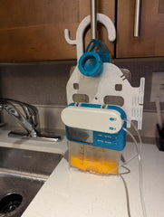 HelperKat Pump Caddy accessory hook adds extra convenience in small spaces.
