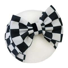 HELYKAKA racing checkered flag headband adds sporty flair to baby girl outfits.